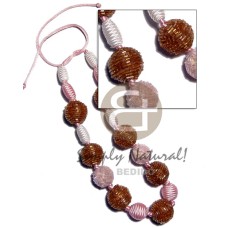 Capsule wrapped wood beads