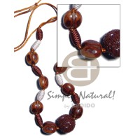 Capsule wrapped wood beads