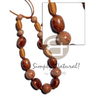 Capsule wrapped wood beads
