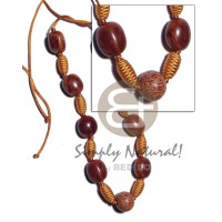 Capsule wrapped wood beads
